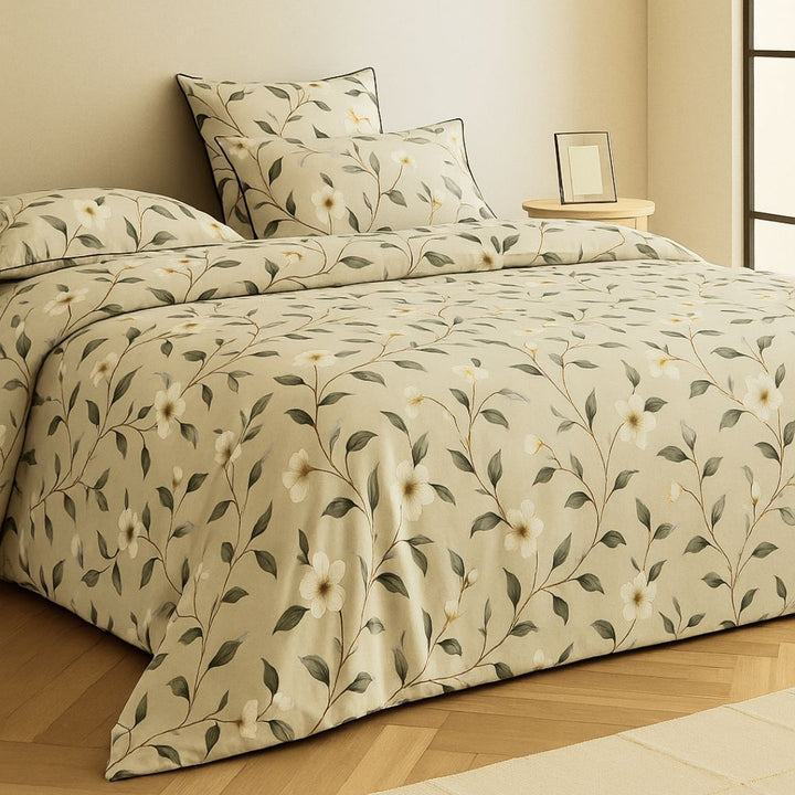 Floral patterned bedsheets pakistan with a duvet cover and two pillows on a light background